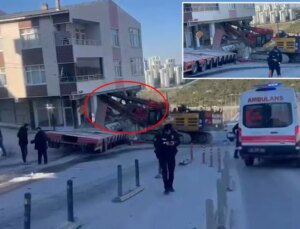 Yokuştan kayan iş makinesi apartmana daldı