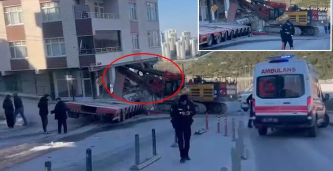 Yokuştan kayan iş makinesi apartmana daldı